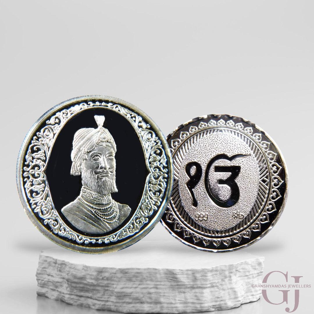 Silver Coin 24KT Purity Round Shape Front side Guru Gobin Singh - Backside Ek Onkar - Ghanshyamdas Jewellers