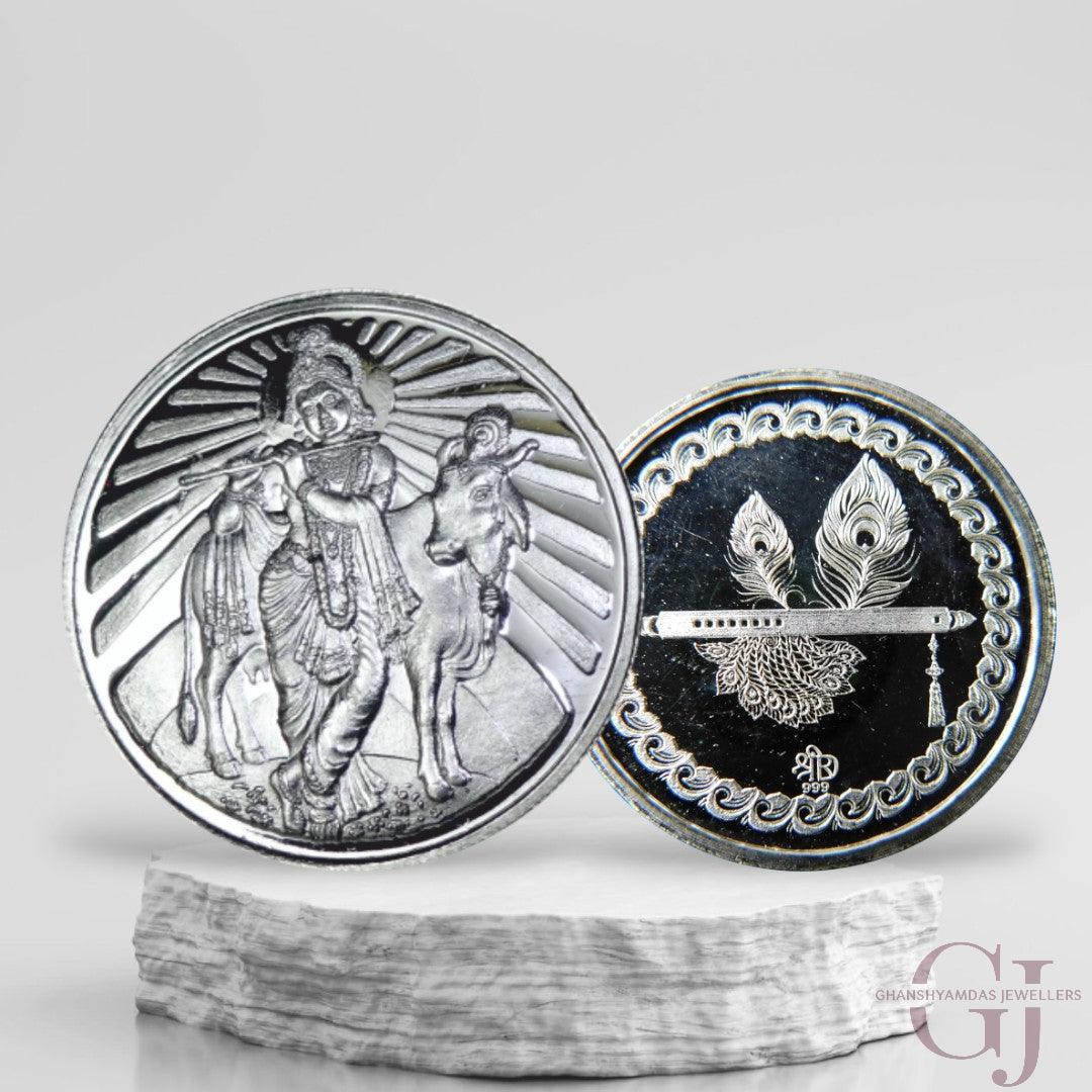 Silver Coin 24KT Purity Round Shape Front side God Krishna With Cow/Gau Mata - Backside Feather And Flute/Basuri - Ghanshyamdas Jewellers